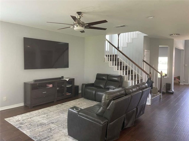 2133 Wellington Ln, Slidell, LA 70461 - living area with ceiling fan, baseboards, stairway, and dark wood finished floors
