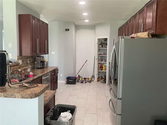 2133 Wellington Ln, Slidell, LA 70461 - kitchen featuring appliances with stainless steel finishes, tasteful backsplash, a sink, light tile patterned floors, and recessed lighting