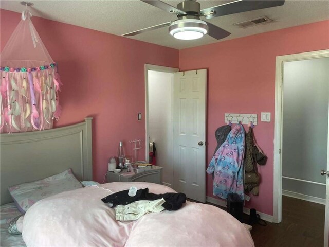 2133 Wellington Ln, Slidell, LA 70461 - bedroom with wood finished floors, ceiling fan, and baseboards