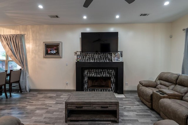 136 Oak Leaf Dr, Slidell, LA 70461 - living room with a ceiling fan, recessed lighting, wood finished floors, baseboards, and a fireplace