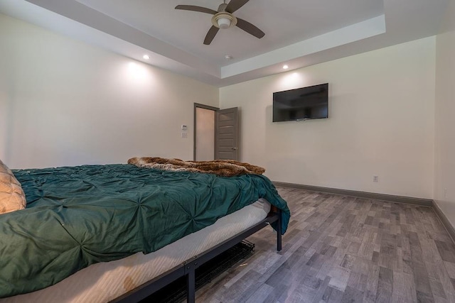 136 Oak Leaf Dr, Slidell, LA 70461 - bedroom featuring a raised ceiling, wood finished floors, recessed lighting, baseboards, and ceiling fan
