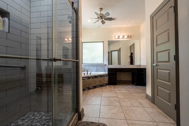 136 Oak Leaf Dr, Slidell, LA 70461 - full bathroom with a bath, vanity, a shower stall, a ceiling fan, and tile patterned flooring