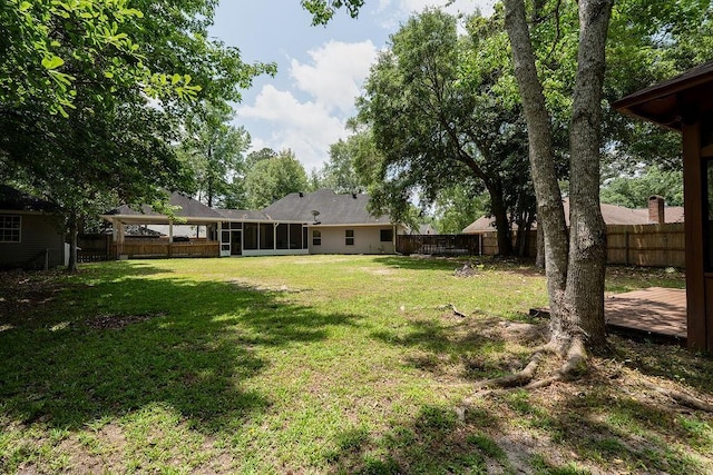 136 Oak Leaf Dr, Slidell, LA 70461 - view of yard featuring a sunroom