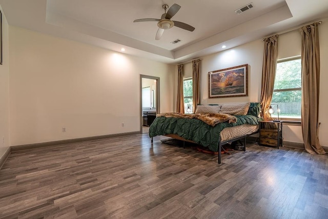 136 Oak Leaf Dr, Slidell, LA 70461 - bedroom with a tray ceiling, wood finished floors, baseboards, recessed lighting, and ceiling fan