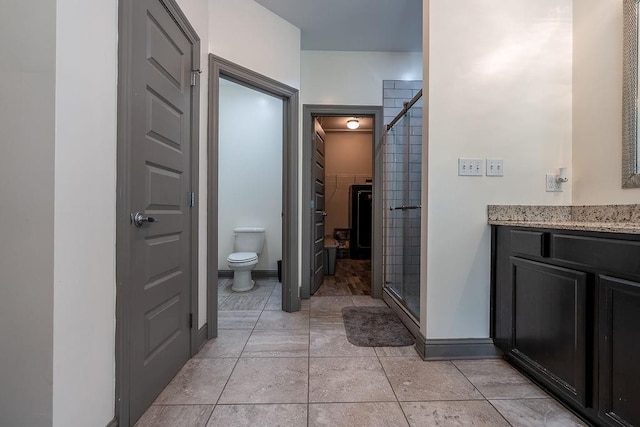 136 Oak Leaf Dr, Slidell, LA 70461 - full bath featuring a shower stall, toilet, baseboards, and vanity