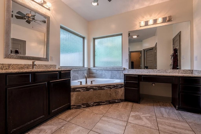 136 Oak Leaf Dr, Slidell, LA 70461 - full bathroom featuring a garden tub, two vanities, and ceiling fan