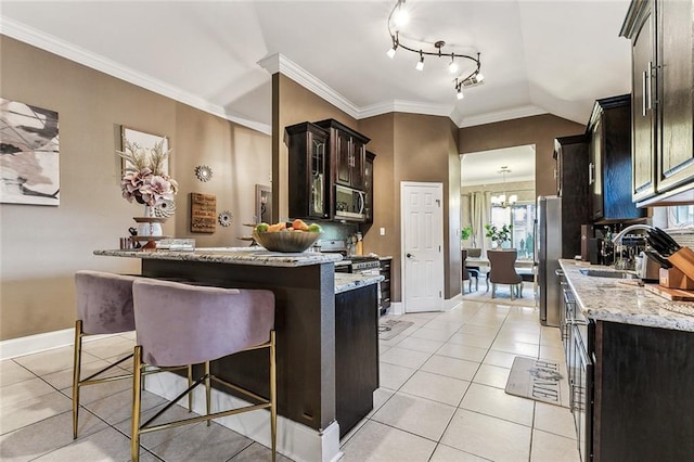 3525 Van Cleave Dr, Meraux, LA 70075 - kitchen featuring appliances with stainless steel finishes, light tile patterned floors, light stone counters, crown molding, and a kitchen bar