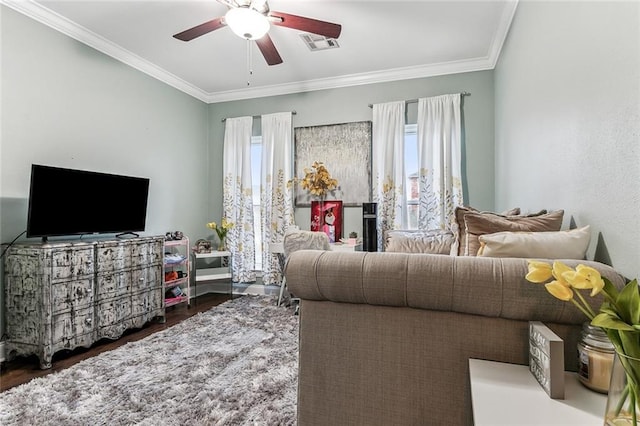 3525 Van Cleave Dr, Meraux, LA 70075 - living area featuring plenty of natural light, a ceiling fan, ornamental molding, and wood finished floors