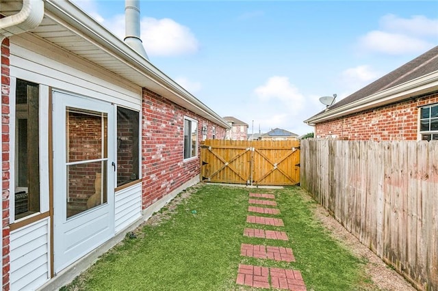 3525 Van Cleave Dr, Meraux, LA 70075 - view of yard with a gate