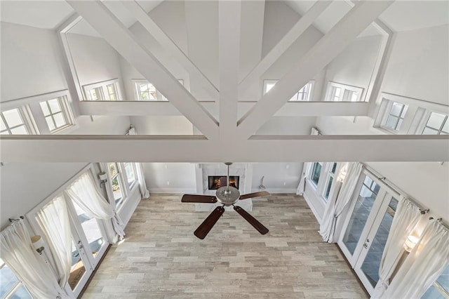 344 Ormond Dr, Covington, LA 70433 - unfurnished living room featuring a high ceiling, wood finished floors, a ceiling fan, and baseboards