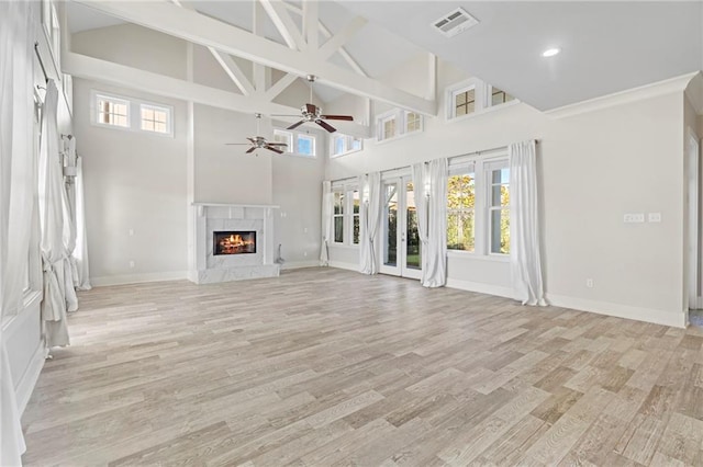 344 Ormond Dr, Covington, LA 70433 - unfurnished living room featuring a ceiling fan, high vaulted ceiling, light wood-style floors, baseboards, and a high end fireplace