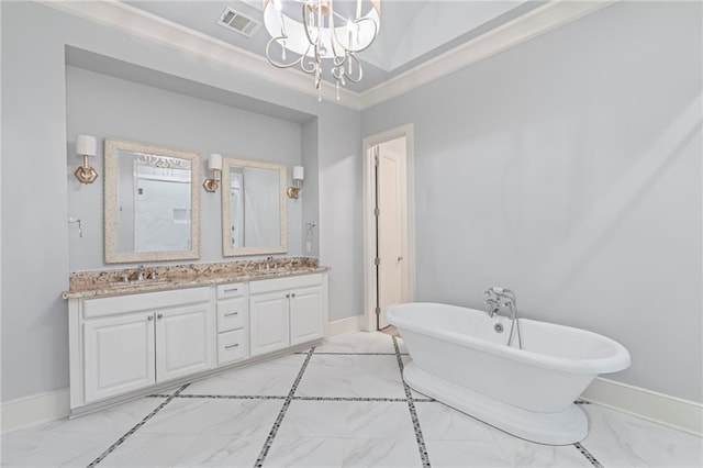 344 Ormond Dr, Covington, LA 70433 - bathroom with double vanity, a chandelier, a freestanding tub, baseboards, and crown molding