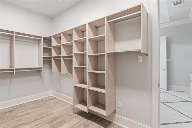 344 Ormond Dr, Covington, LA 70433 - walk in closet with wood finished floors
