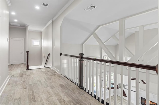 344 Ormond Dr, Covington, LA 70433 - hallway with wood finished floors, recessed lighting, crown molding, baseboards, and an upstairs landing