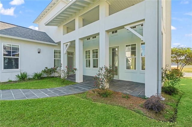 344 Ormond Dr, Covington, LA 70433 - property entrance featuring stucco siding, a yard, and roof with shingles