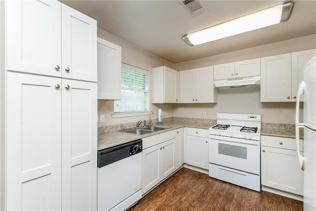 1029 W 32nd Ave, Covington, LA 70433 - kitchen featuring white appliances, under cabinet range hood, a sink, light countertops, and white cabinetry