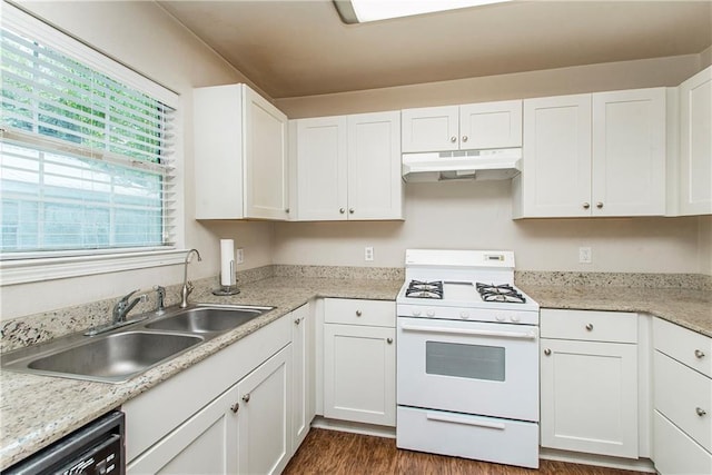 1029 W 32nd Ave, Covington, LA 70433 - kitchen with under cabinet range hood, white range with gas stovetop, dishwasher, and white cabinets