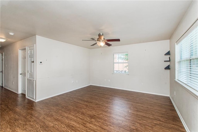 1029 W 32nd Ave, Covington, LA 70433 - empty room featuring wood finished floors, a ceiling fan, and baseboards