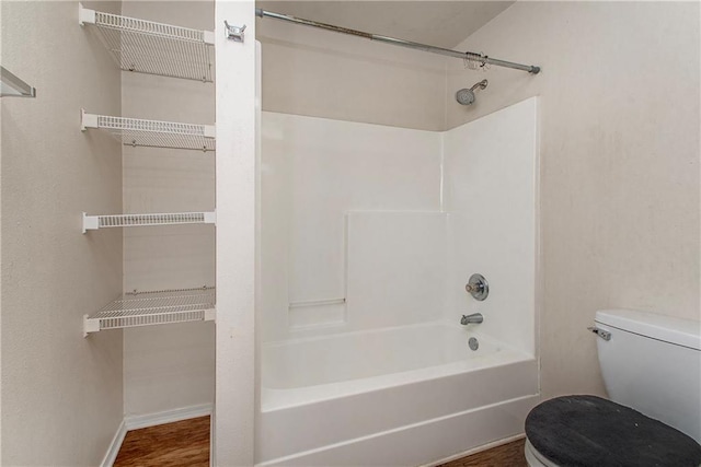 1029 W 32nd Ave, Covington, LA 70433 - full bath featuring toilet, shower / washtub combination, and baseboards