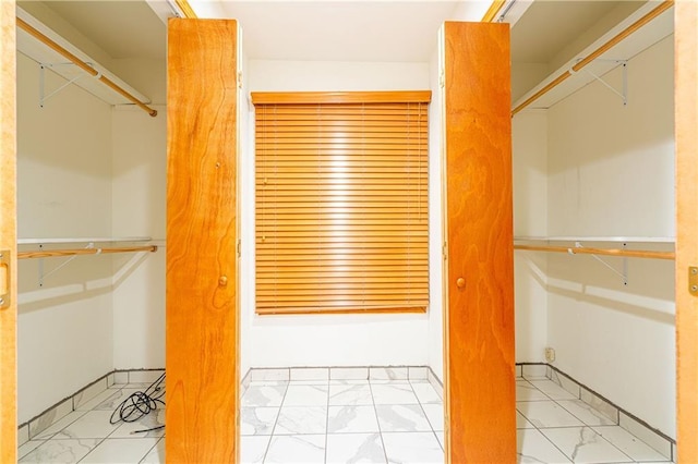 131 Ann St, Saint Rose, LA 70087 - walk in closet featuring marble look tile flooring