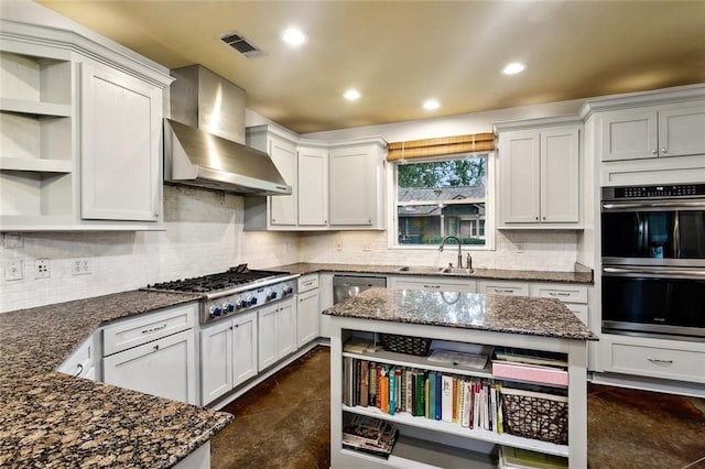234 Blue Crane 1 Dr, Slidell, LA 70461 - kitchen with open shelves, wall chimney exhaust hood, appliances with stainless steel finishes, a sink, and recessed lighting