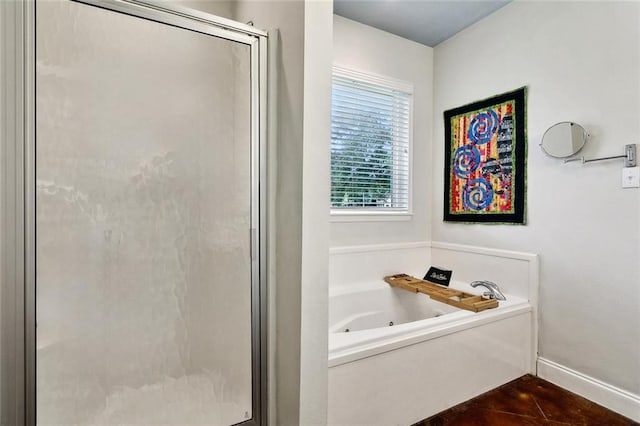 234 Blue Crane 1 Dr, Slidell, LA 70461 - full bath featuring a stall shower, a jetted tub, and baseboards