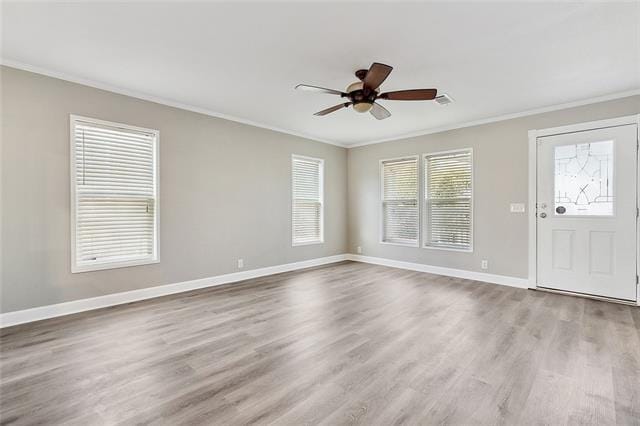 15 E Chalmette Cir, Chalmette, LA 70043 - empty room featuring ornamental molding, ceiling fan, wood finished floors, and baseboards