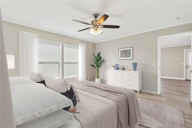 15 E Chalmette Cir, Chalmette, LA 70043 - bedroom with light wood-style floors, baseboards, a ceiling fan, and ornamental molding
