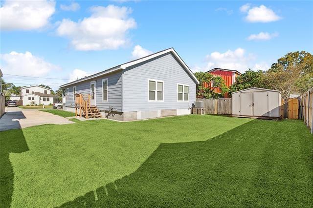 15 E Chalmette Cir, Chalmette, LA 70043 - rear view of house with cooling unit