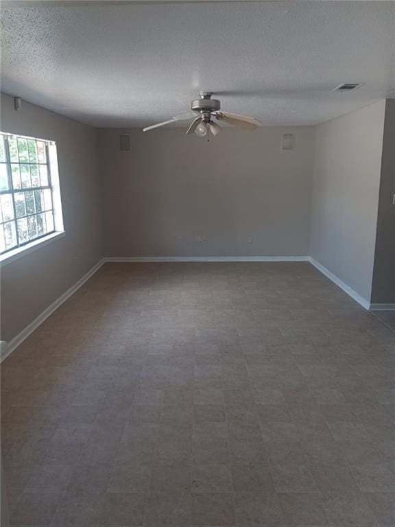 1938 Longwood Ct, La Place, LA 70068 - spare room featuring a ceiling fan, a textured ceiling, and baseboards