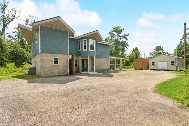 23396 S Maple Dr, Ponchatoula, LA 70454 - contemporary home featuring dirt driveway and brick siding