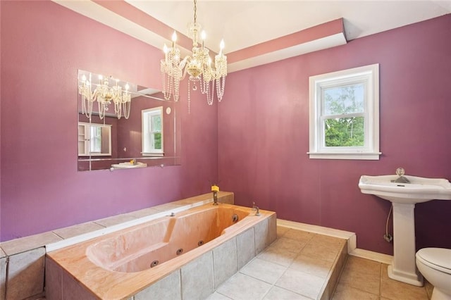 23396 S Maple Dr, Ponchatoula, LA 70454 - full bathroom featuring a tub with jets, a chandelier, tile patterned flooring, toilet, and baseboards