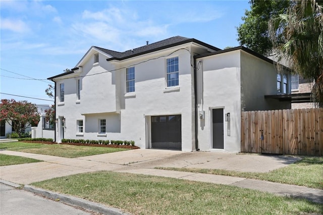 2526 Metairie Rd, Metairie, LA 70001 - view of front facade with a garage, stucco siding, and concrete driveway