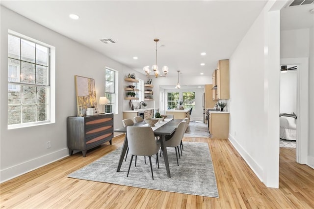 2526 Metairie Rd, Metairie, LA 70001 - dining space with a chandelier, baseboards, light wood finished floors, and recessed lighting