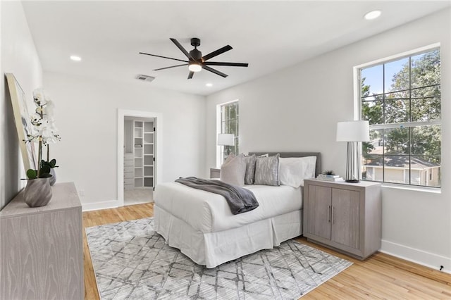 2526 Metairie Rd, Metairie, LA 70001 - bedroom featuring multiple windows, light wood-style flooring, baseboards, and recessed lighting