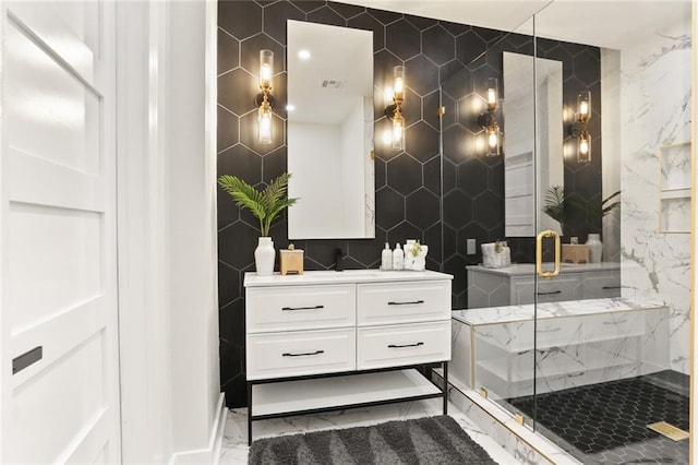 2526 Metairie Rd, Metairie, LA 70001 - full bathroom featuring tile walls, marble finish floors, vanity, and a marble finish shower