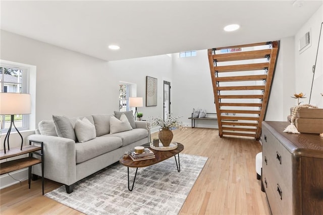 2526 Metairie Rd, Metairie, LA 70001 - living room with light wood-type flooring, stairs, recessed lighting, and baseboards