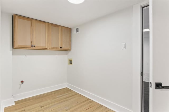 2526 Metairie Rd, Metairie, LA 70001 - laundry area featuring cabinet space, baseboards, hookup for a washing machine, and light wood finished floors