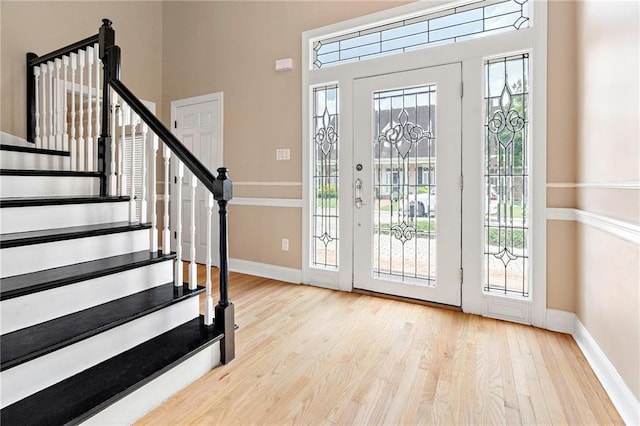 1 Miller Ln, Metairie, LA 70002 - foyer featuring baseboards, wood finished floors, and stairway