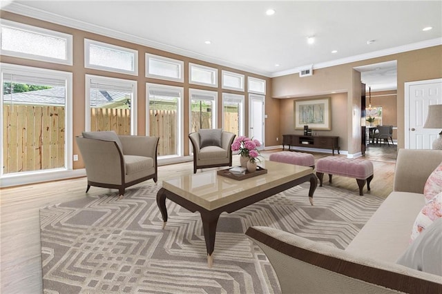 1 Miller Ln, Metairie, LA 70002 - living room featuring crown molding, recessed lighting, and light wood-style floors
