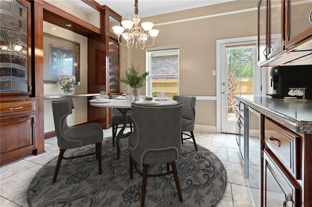 1 Miller Ln, Metairie, LA 70002 - dining area with crown molding, a chandelier, and baseboards