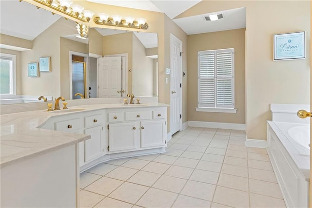 1 Miller Ln, Metairie, LA 70002 - full bathroom featuring double vanity, lofted ceiling, a bath, tile patterned floors, and baseboards