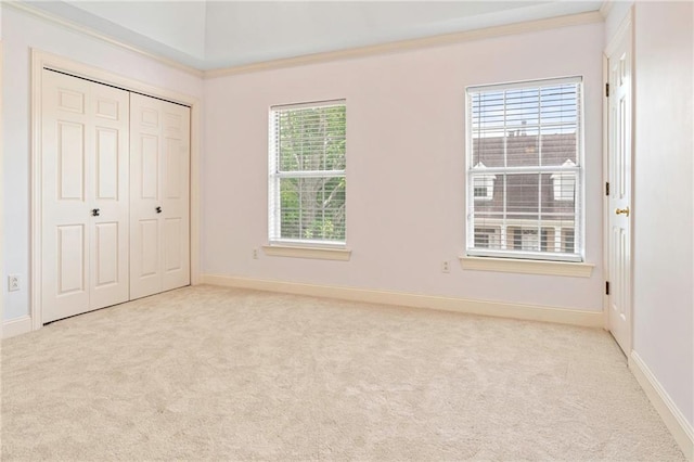 1 Miller Ln, Metairie, LA 70002 - unfurnished bedroom featuring carpet floors, baseboards, a closet, and ornamental molding