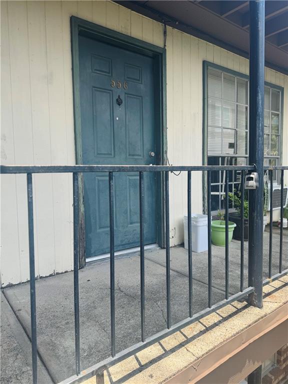 6220 Riverside Dr Unit 556, Metairie, LA 70003 - doorway to property featuring covered porch