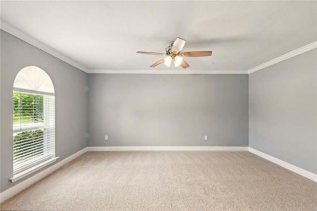 1900 Woods Dr, Metairie, LA 70001 - empty room with a ceiling fan, baseboards, crown molding, and light carpet