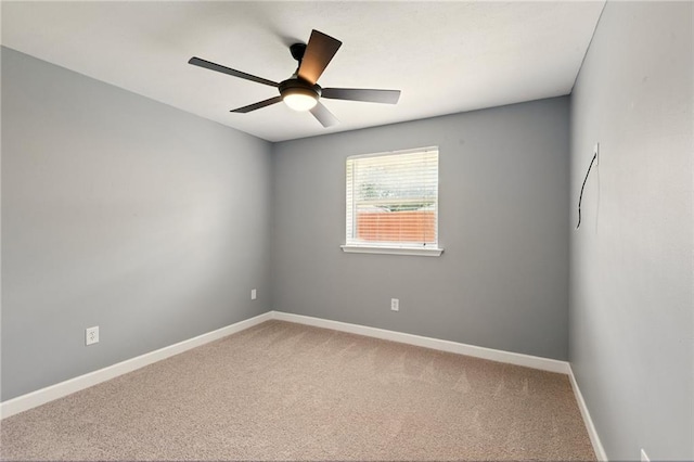 1900 Woods Dr, Metairie, LA 70001 - carpeted empty room featuring baseboards and a ceiling fan