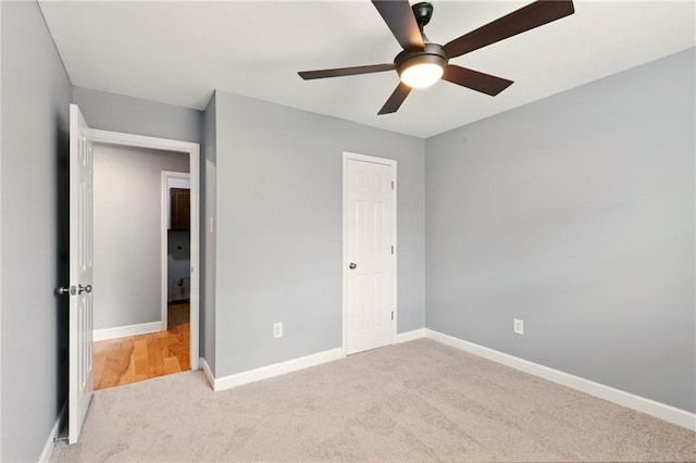 1900 Woods Dr, Metairie, LA 70001 - unfurnished bedroom featuring carpet floors, baseboards, and a ceiling fan