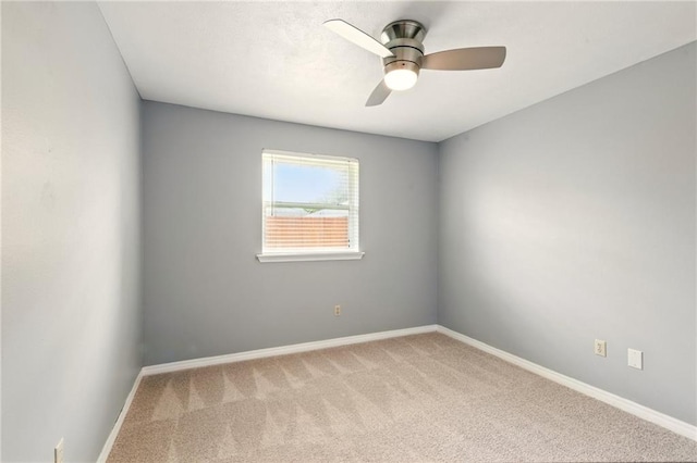 1900 Woods Dr, Metairie, LA 70001 - carpeted empty room featuring a ceiling fan and baseboards