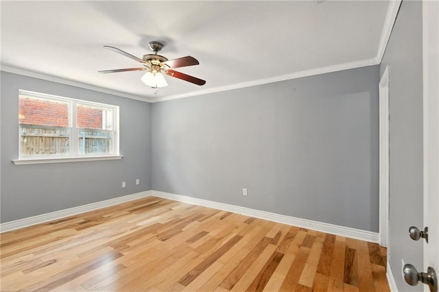 1900 Woods Dr, Metairie, LA 70001 - unfurnished room featuring ceiling fan, light wood-type flooring, crown molding, and baseboards