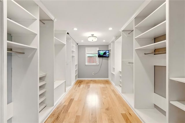 1900 Woods Dr, Metairie, LA 70001 - walk in closet with light wood-style floors